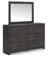 Hollivern King Panel Bed with Mirrored Dresser and Nightstand